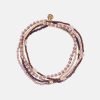 Armband in Rosa, Gold und Rot-Violetten Tönen mit kleinen Anhänger in Gold